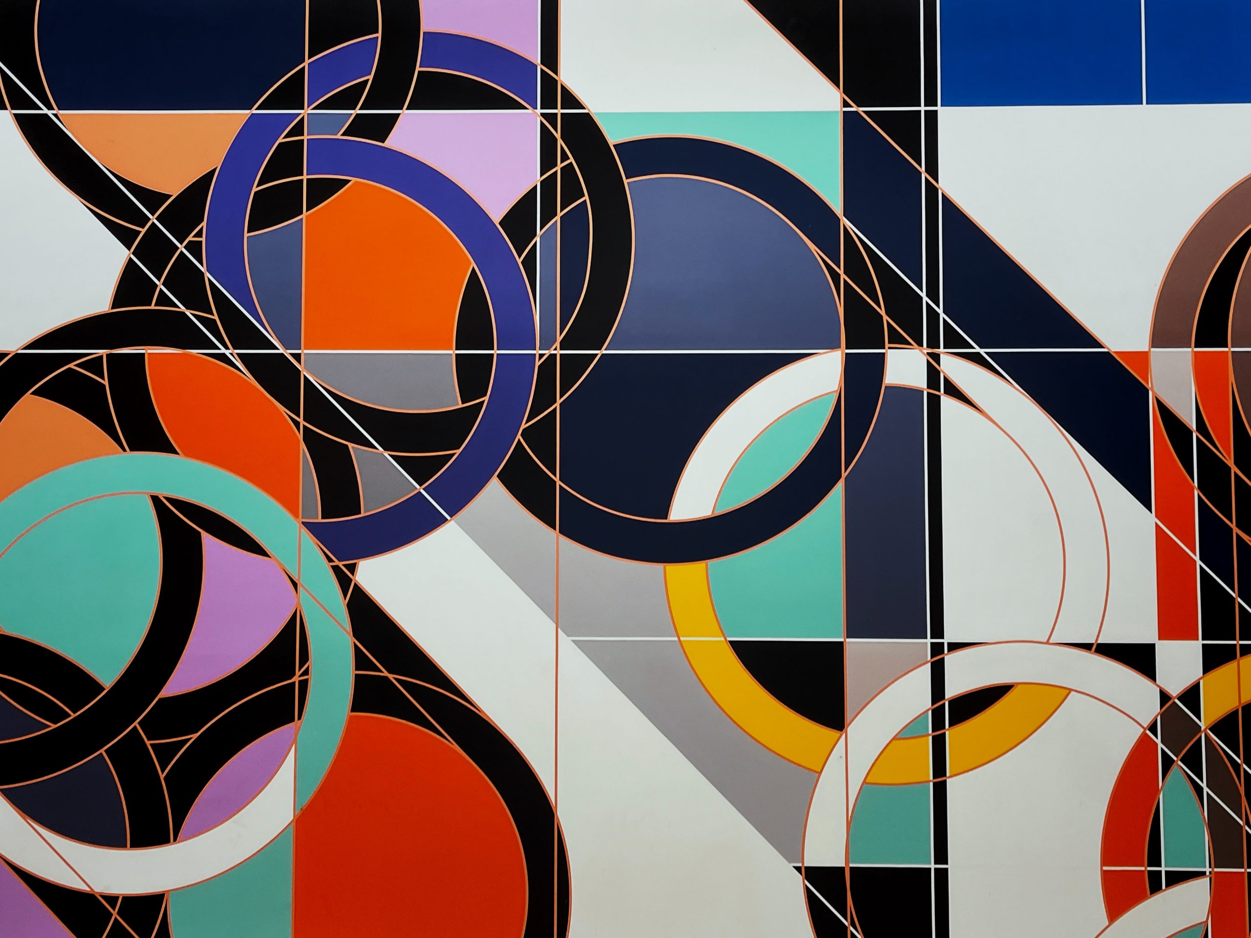 An abstract graphic design featuring interlocking geometric colorful circles and clean lines.