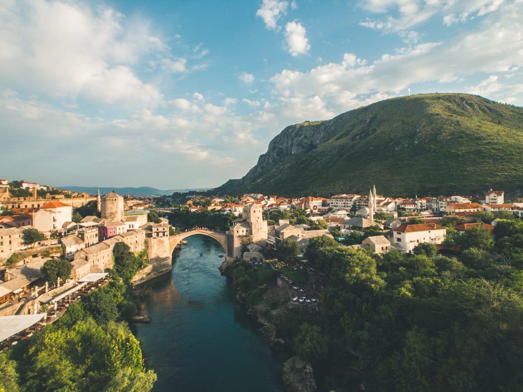 yu-siang-teo-GZjH4cVGgCs-unsplash Town with bridge over river